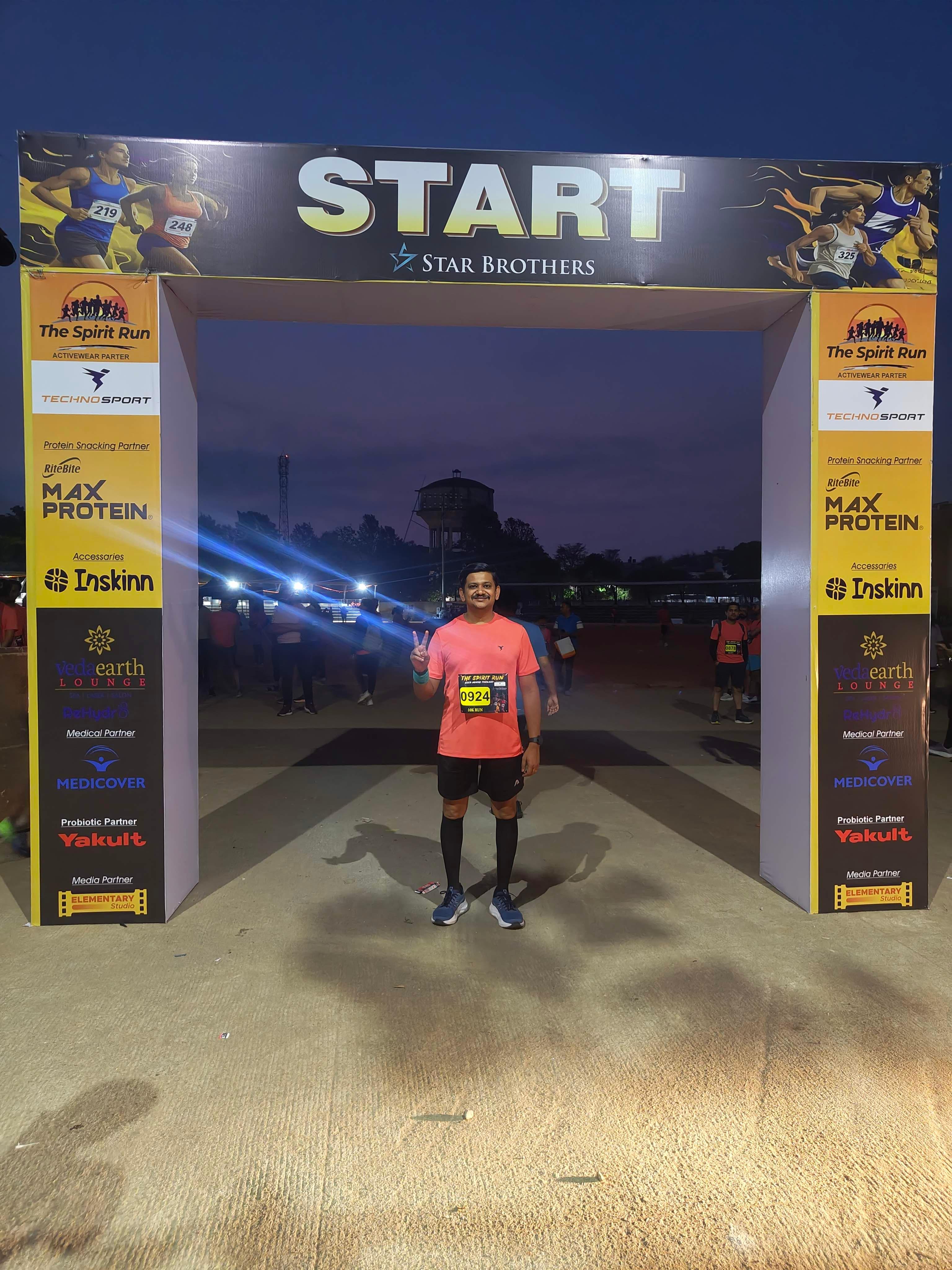 Akshay at the START line of The Spirit Run 10k race, pre-dawn, April 19 2026